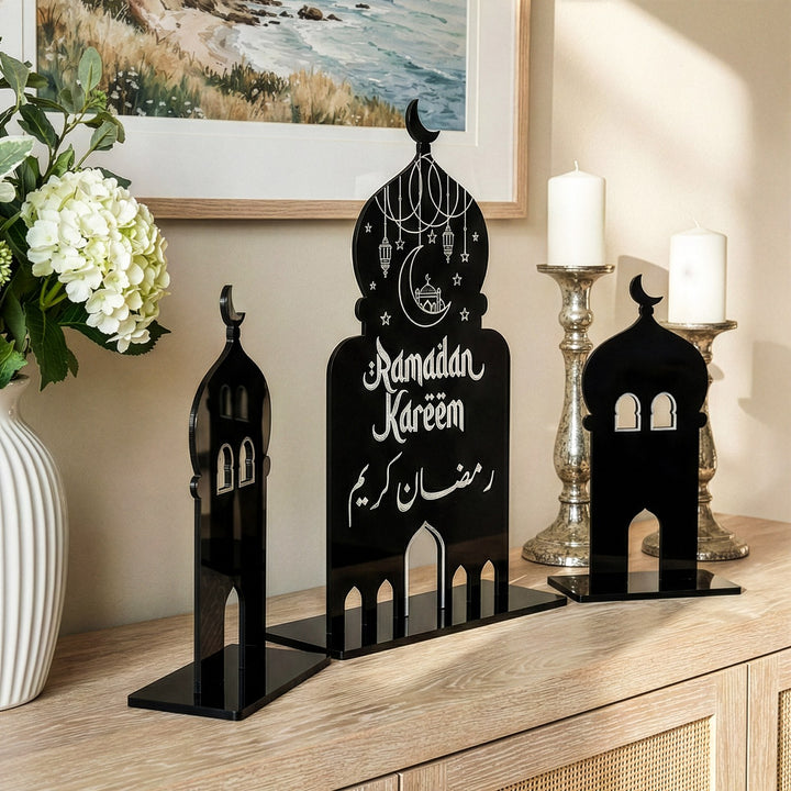 Detailed view of the minaret silhouettes and festive lantern illustrations on the black acrylic Ramadan centerpiece.