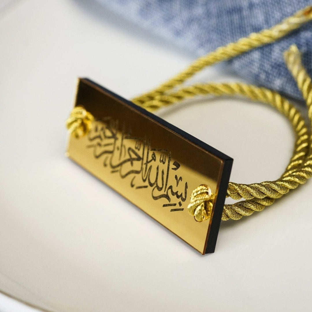 Thuluth Bismillah napkin holder with cord on a set table