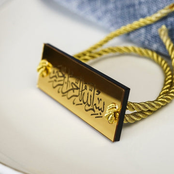 Thuluth Bismillah napkin holder with cord on a set table