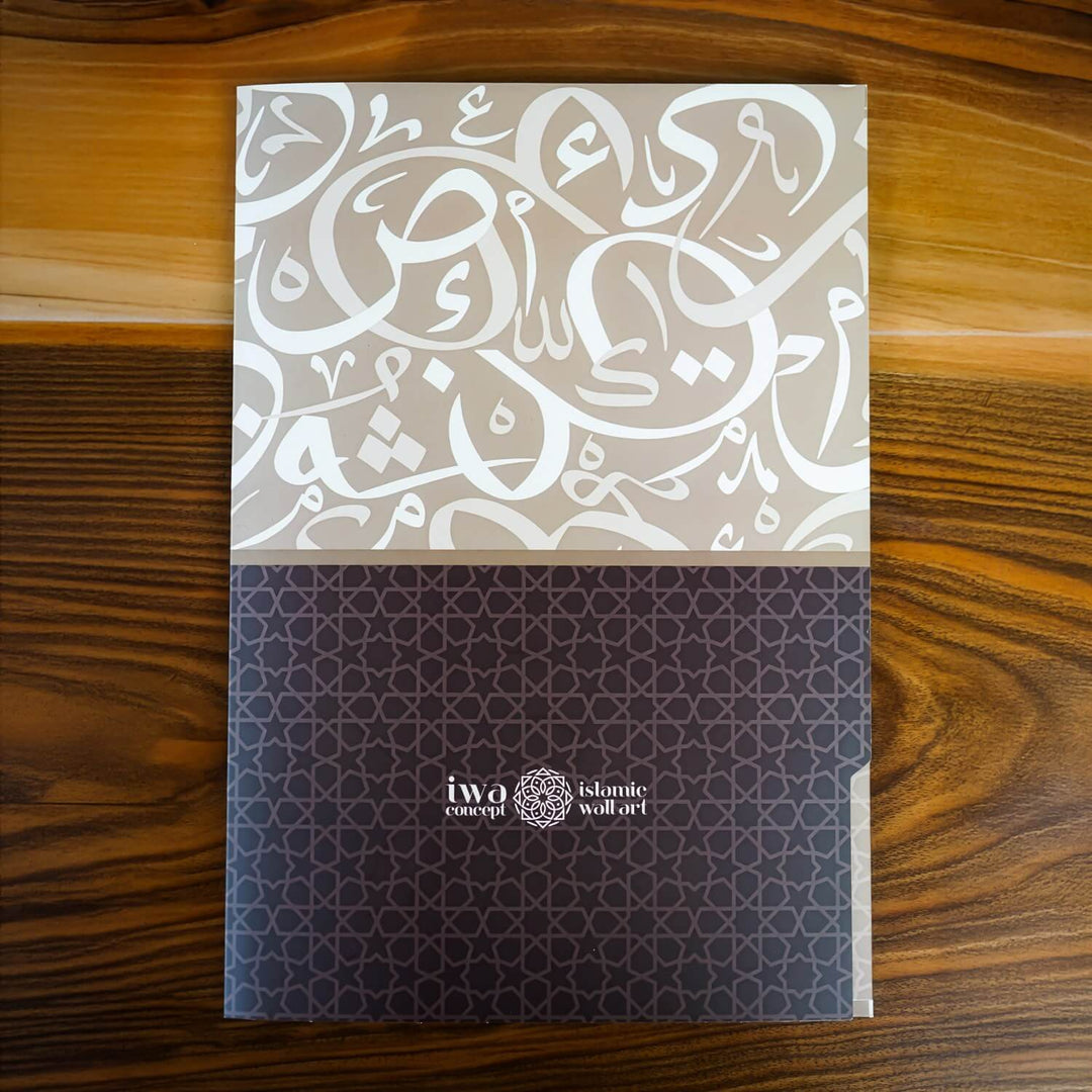 Book with Arabic calligraphy on a wooden surface