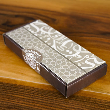 Rectangular box with decorative pattern on a wooden surface