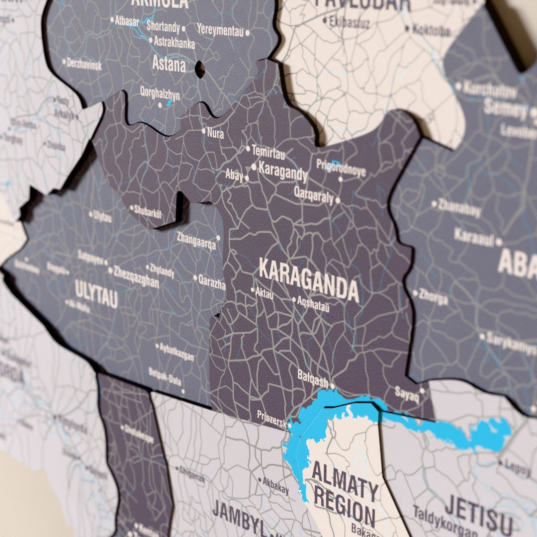 Close-up of the Nimbus Kazakhstan wooden wall map with layered regions and printed names