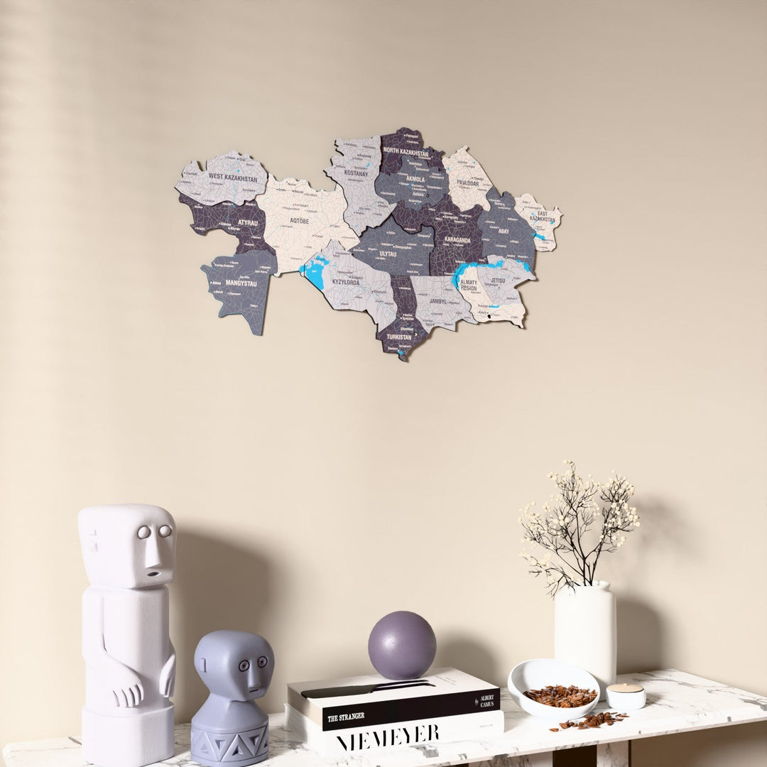 Nimbus Kazakhstan wooden wall map on a beige wall above a console with figurines