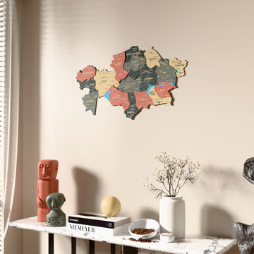 Sage Kazakhstan wooden wall map beside a sheer curtain, angled view