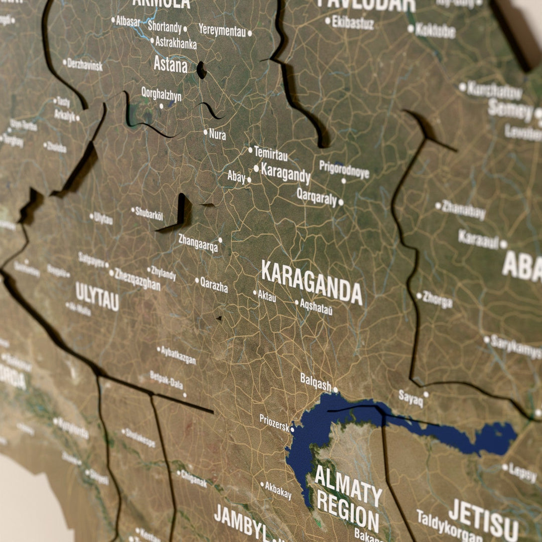 Close-up of the Satellite Kazakhstan wooden wall map with layered regions and printed names