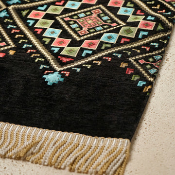 Kilim Prayer Rug in Black: close-up of the corner, kilim motifs and fringe