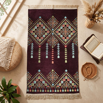 Kilim Prayer Rug in Plum, top view on the floor next to a Quran stand and cushions