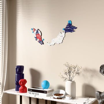 Flag colored Malaysia wooden wall map beside a sheer curtain, angled view