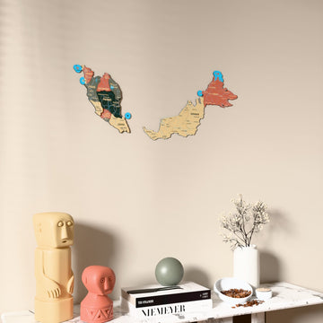Sage Malaysia wooden wall map on a beige wall above a console with figurines