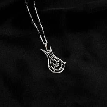 Silver Tulip Mashallah necklace, distant view of the pendant on a fine chain