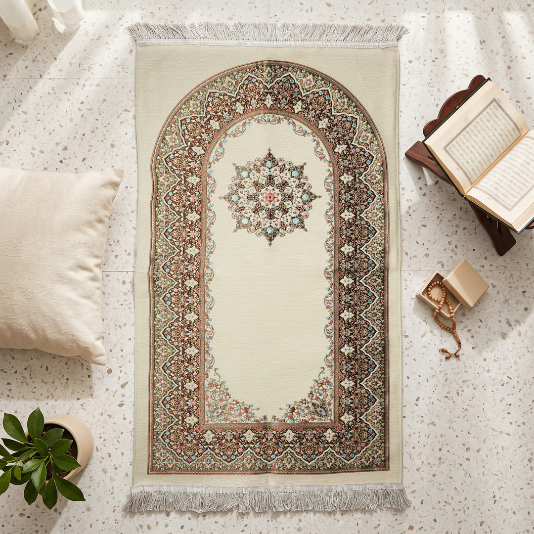 Mihrab Prayer Rug in Cream, top view on the floor next to a Quran stand and cushions