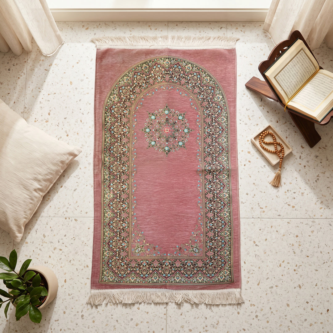 Mihrab Prayer Rug in Dried Rose, top view on the floor next to a Quran stand and cushions