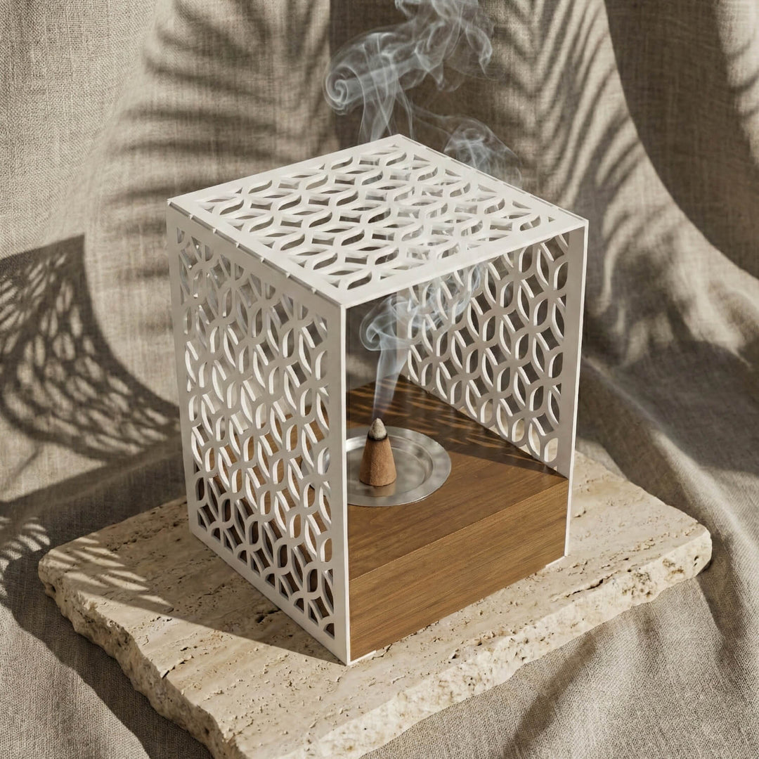 Wooden base mabkhara with a white Petal Lattice metal frame, close view with incense smoke