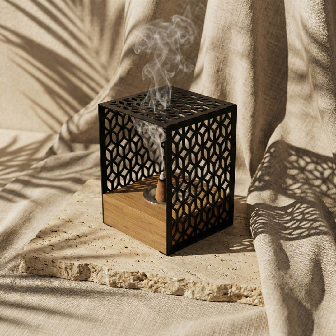 Black Petal Lattice wooden base mabkhara, angled view showing the incense cone inside the frame