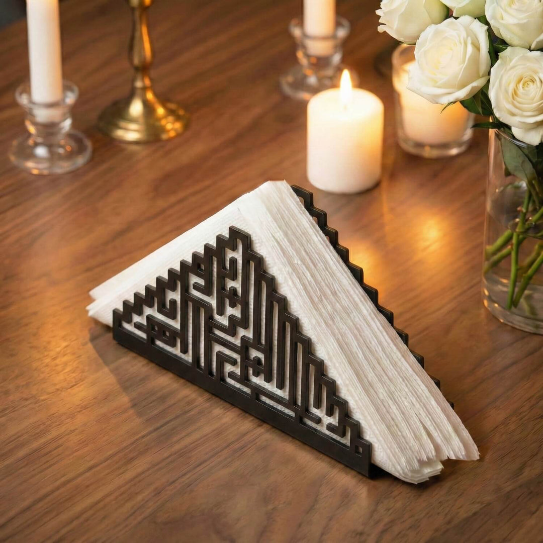 Bismillah Kufic metal napkin holder in black on a set table