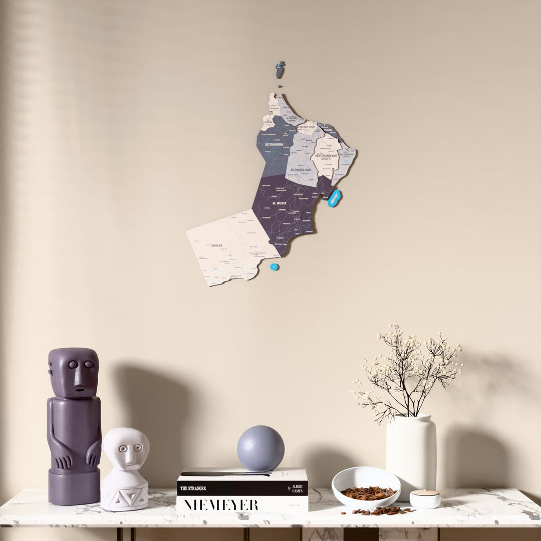 Nimbus Oman wooden wall map above a marble console, front view