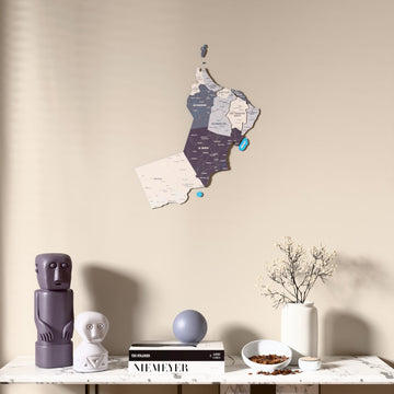 Nimbus Oman wooden wall map above a marble console, front view