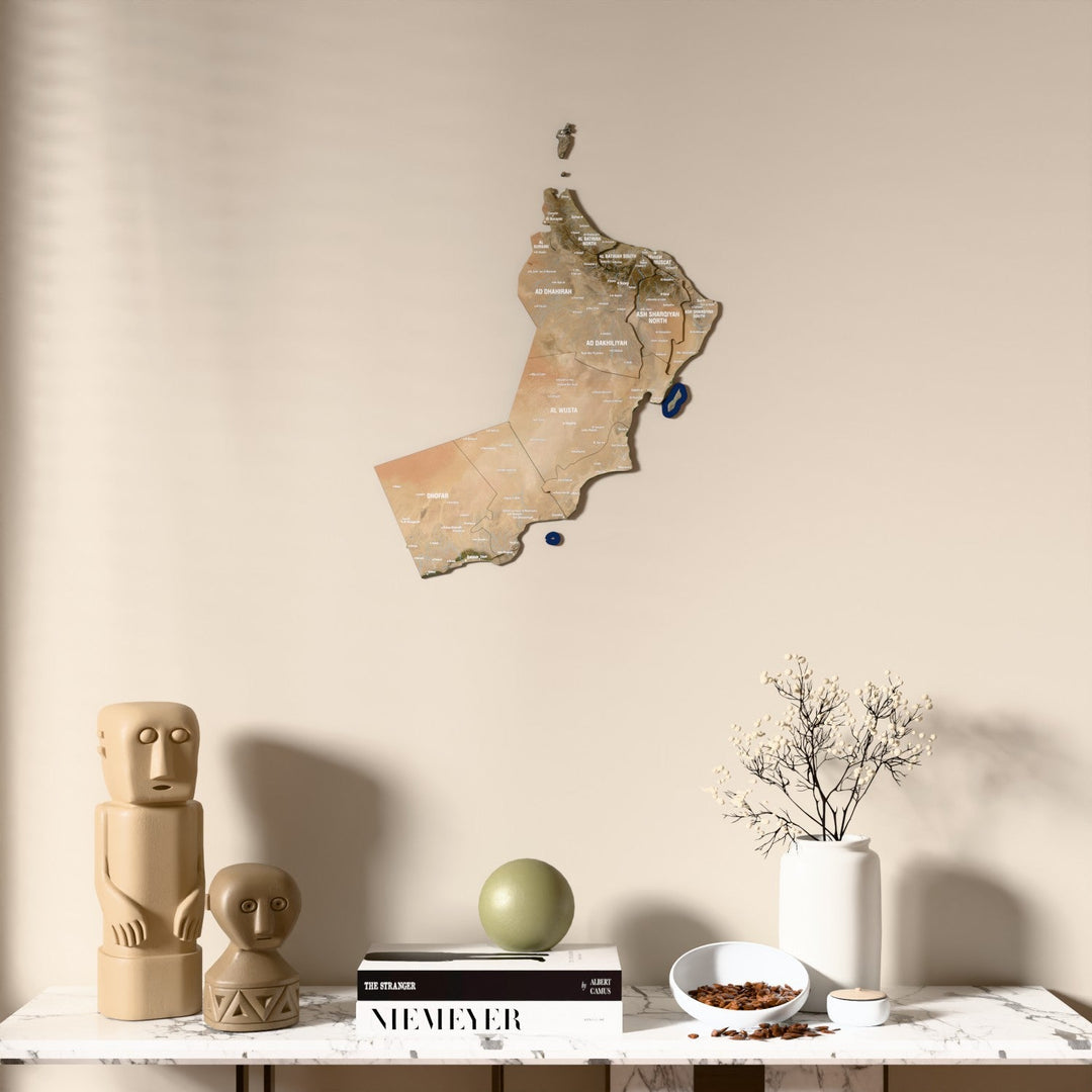 Satellite Oman wooden wall map above a marble console, front view