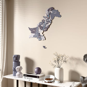 Nimbus Pakistan wooden wall map beside a sheer curtain, angled view