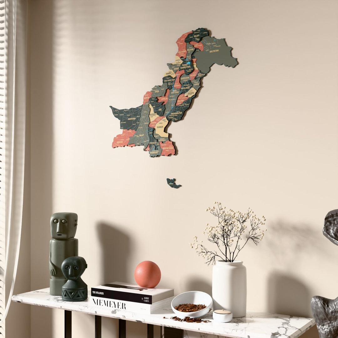 Sage Pakistan wooden wall map beside a sheer curtain, angled view