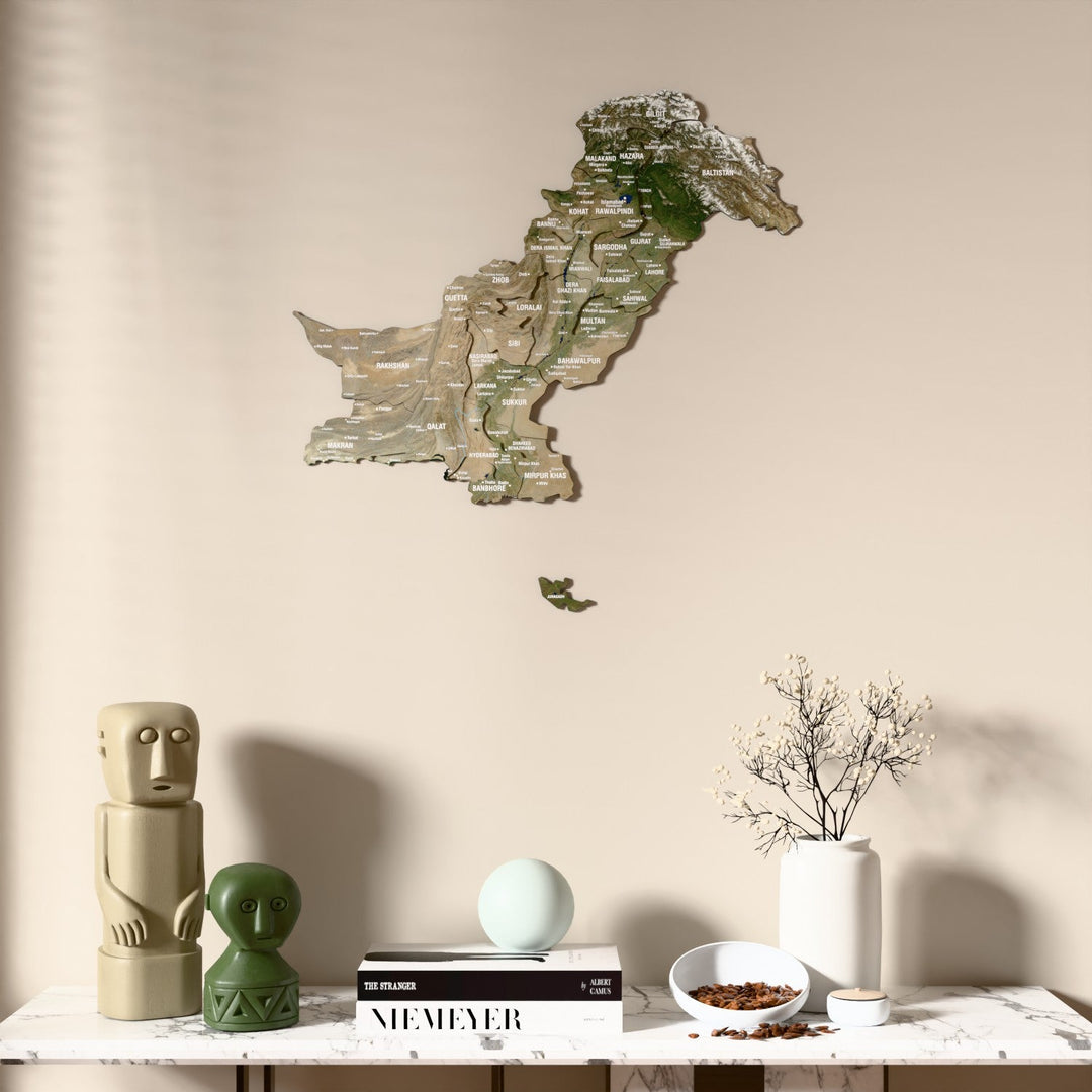 Satellite Pakistan wooden wall map above a marble console, front view