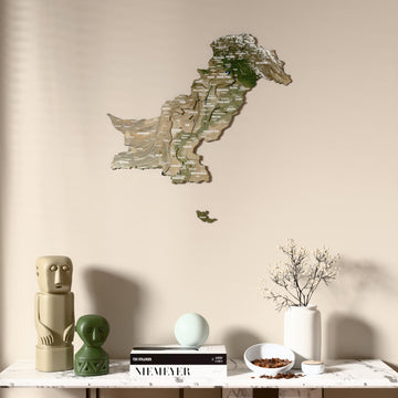 Satellite Pakistan wooden wall map above a marble console, front view