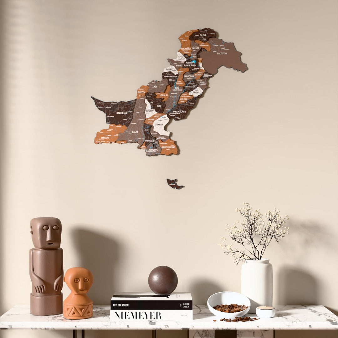 Soil Pakistan wooden wall map above a marble console, front view