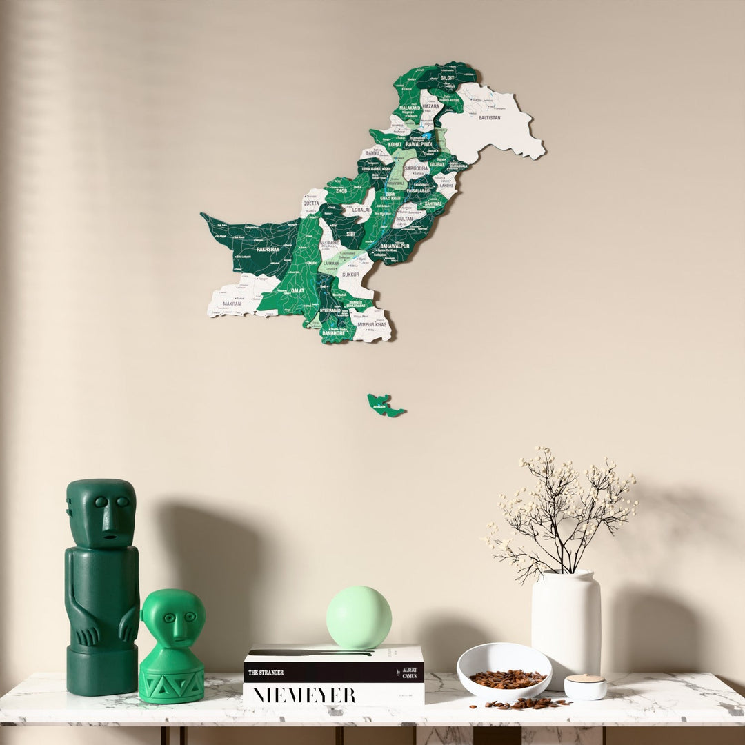 Flag colored Pakistan wooden wall map above a marble console, front view