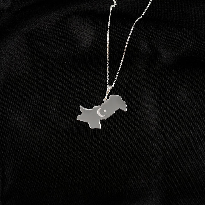 Pakistan map necklace in silver on black satin