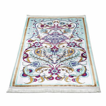 Pastel floral prayer rug with aqua details laid flat in perspective on white