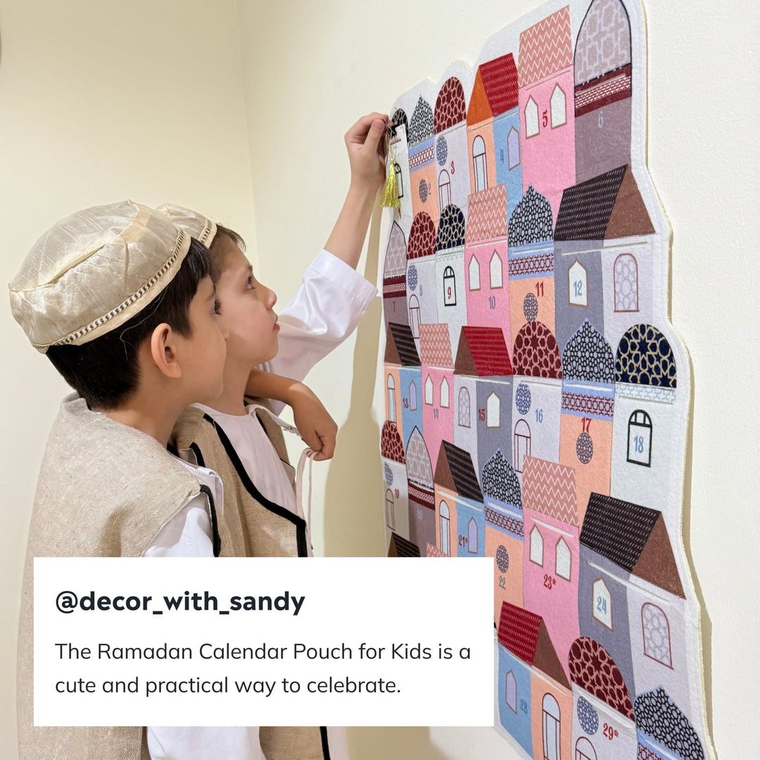 Customer photo of a boy reaching for a pouch on the Ramadan calendar wall hanging