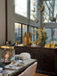 Gold crescent and lantern Ramadan decor on a sideboard in a dining room