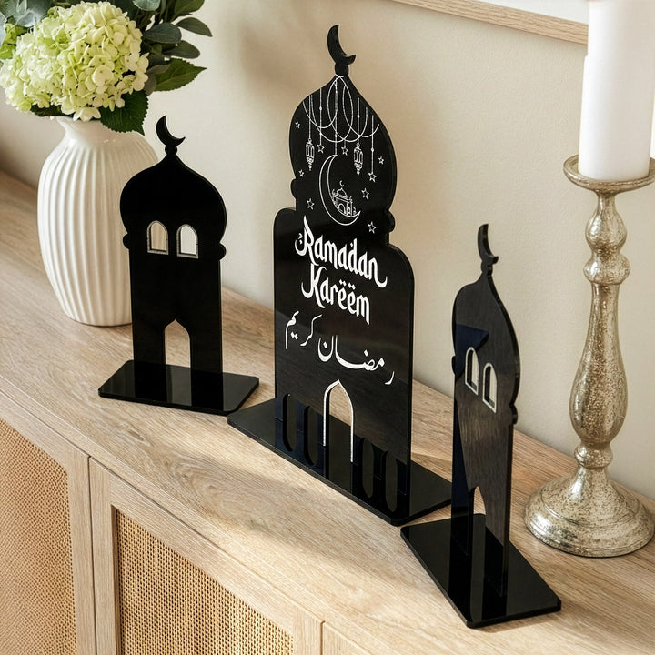 Side angle view of modern Islamic table decor showing the glossy black acrylic finish and sturdy freestanding bases.