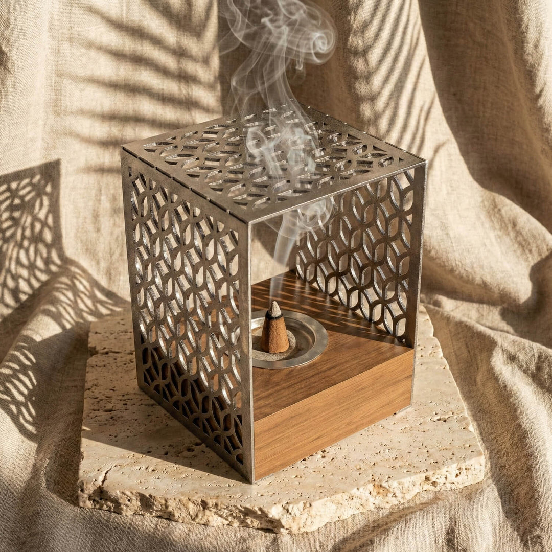 Wooden base mabkhara with a silver Petal Lattice metal frame, close view with incense smoke