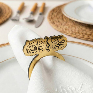 Saha w Afia Thuluth acrylic napkin ring in gold