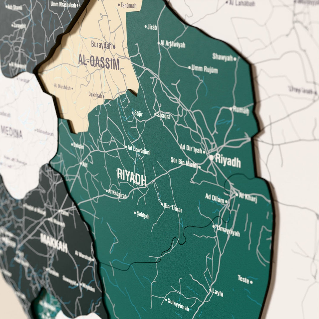 Close-up of the Flag colored Saudi Arabia wooden wall map with layered regions and printed names