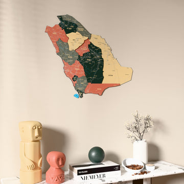 Sage Saudi Arabia wooden wall map on a beige wall above a console with figurines