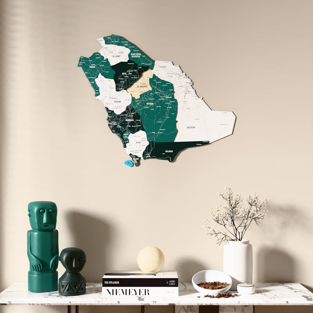 Flag colored Saudi Arabia wooden wall map above a marble console, front view