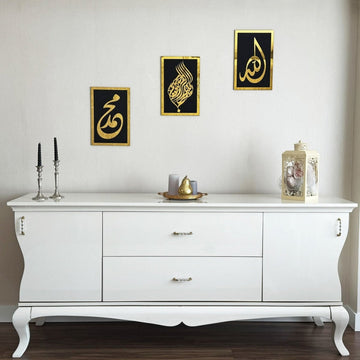 Basmala, Allah and Muhammad wooden wall art set, Gold on Black, hung in a staircase layout above a white console