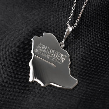 Close-up of the Silver Saudi Arabia map pendant with engraved Shahada and sword, on a chain
