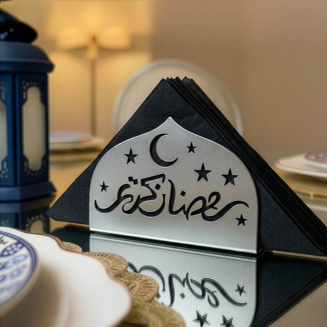 Ramadan Kareem metal napkin holder in silver on a set table