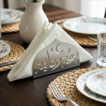 Saha w Afia metal napkin holder in silver on a set table