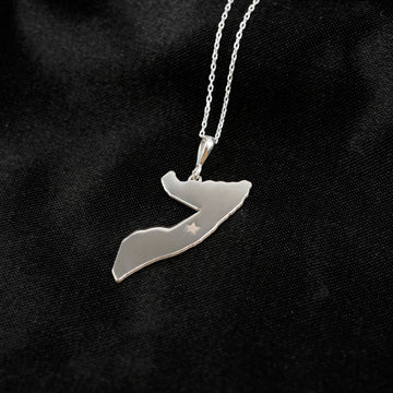 Somalia map necklace in silver on black satin