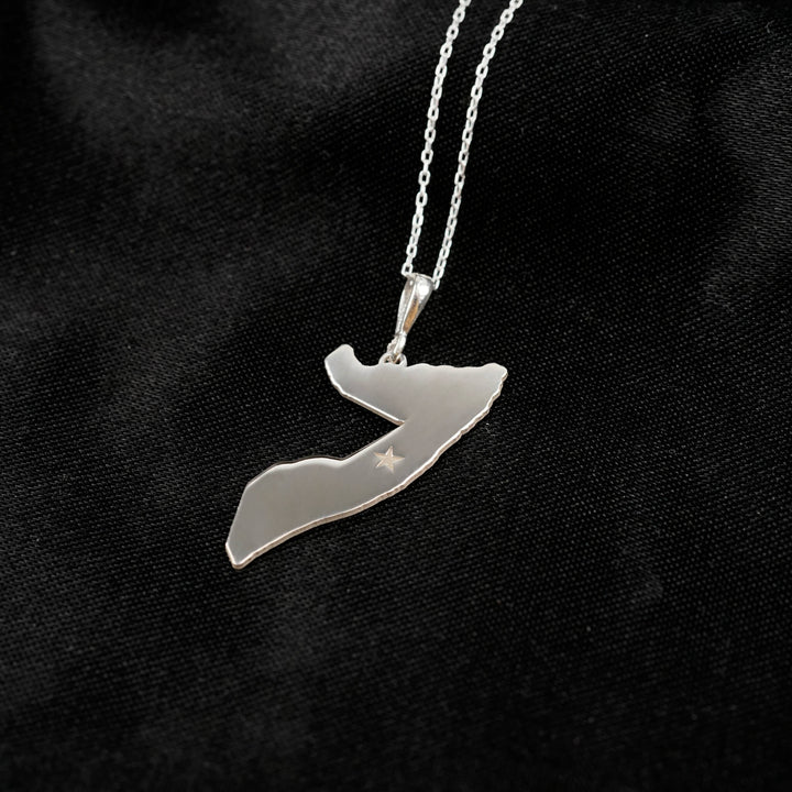 Somalia map necklace in silver on black satin