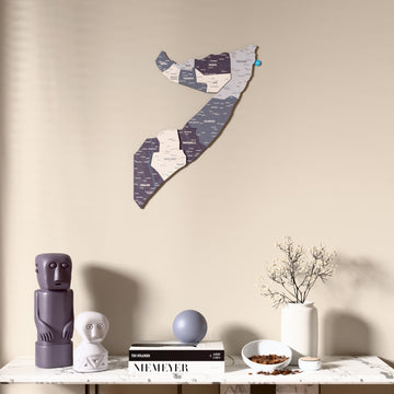 Nimbus Somalia wooden wall map above a marble console, front view