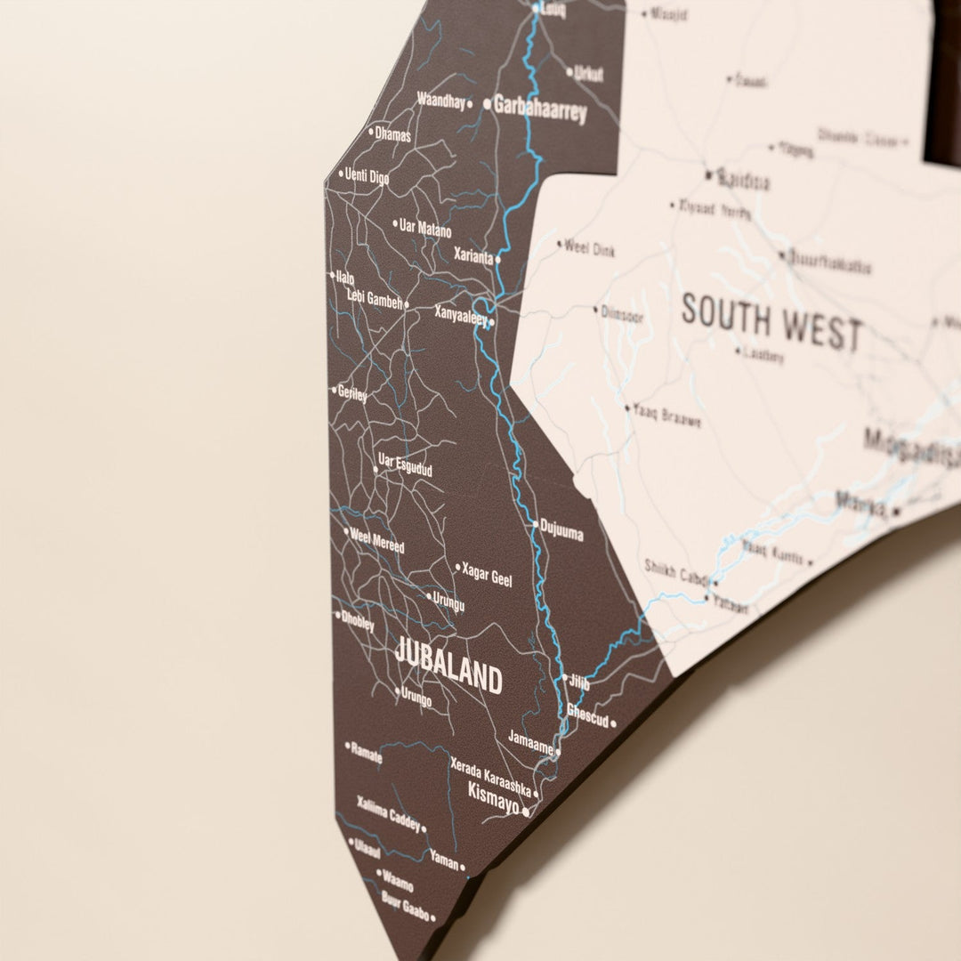 Close-up of the Soil Somalia wooden wall map with layered regions and printed names