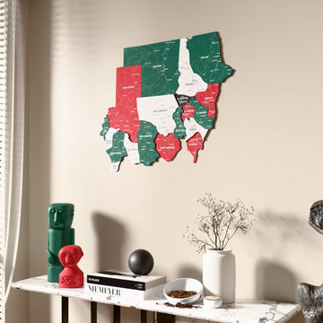 Flag colored Sudan wooden wall map beside a sheer curtain, angled view
