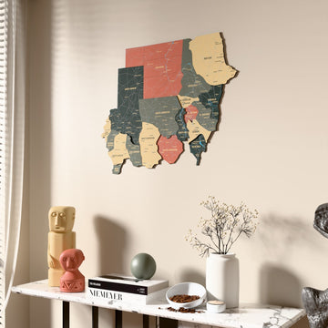 Sage Sudan wooden wall map beside a sheer curtain, angled view