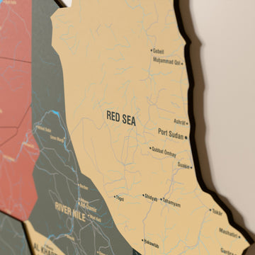 Close-up of the Sage Sudan wooden wall map with layered regions and printed names