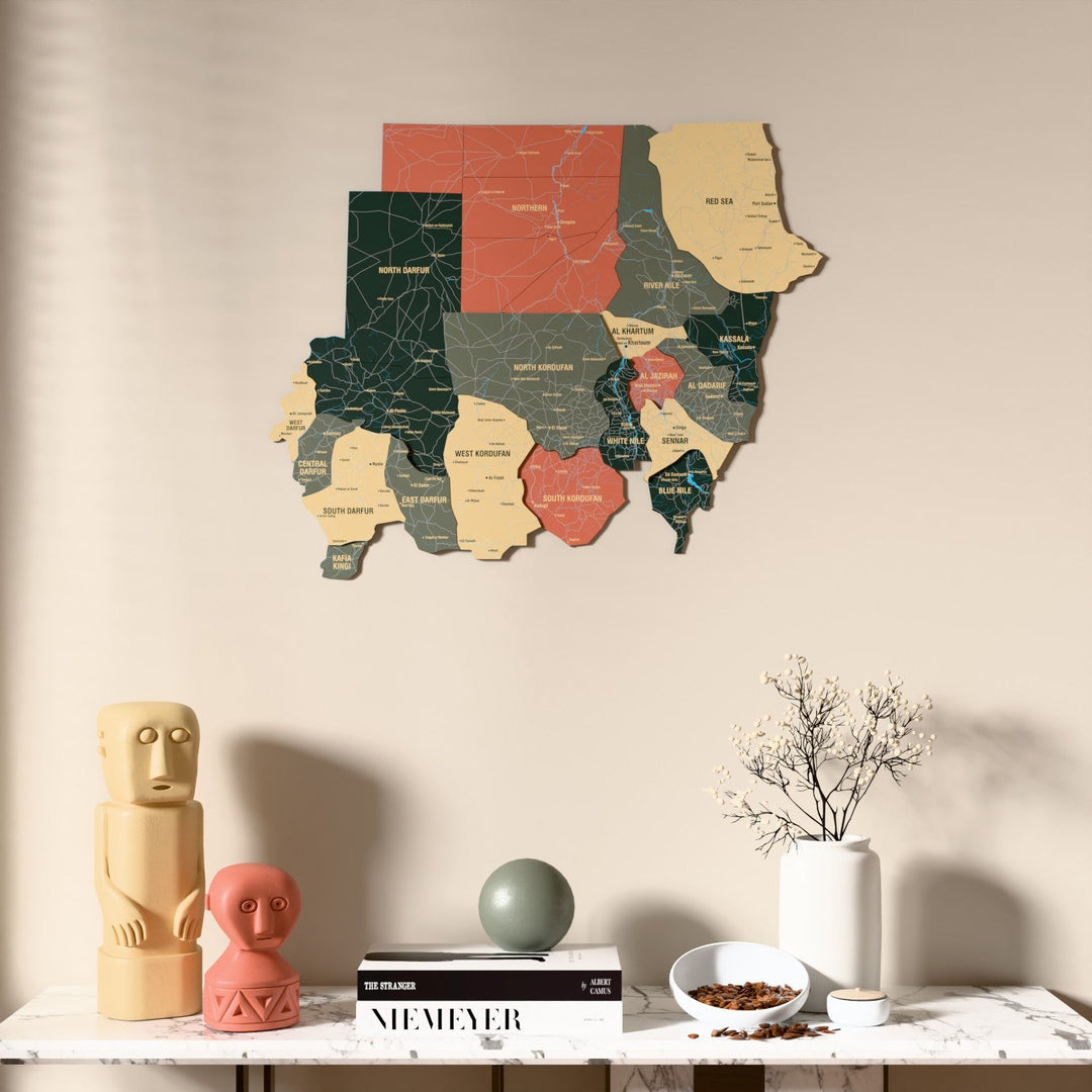 Sage Sudan wooden wall map above a marble console, front view
